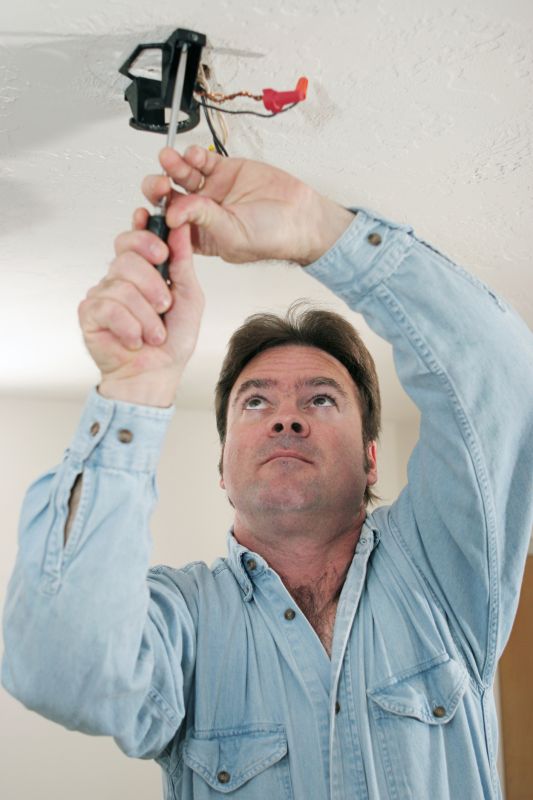Licensed Electrician Installing Fan